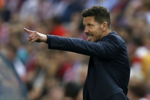 Atletico's head coach Diego Simeone gestures during the Champions League quarterfinal first leg soccer match between Atletico Madrid and Leicester City at the Vicente Calderon stadium in Madrid, Wednesday, April 12, 2017. (AP Photo/Francisco Seco)