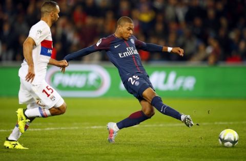 Paris Saint Germain's Kylian Mbappe kicks the ball to score the second goal against Lyon during their French League One soccer match between PSG and Olympique Lyon at the Parc des Princes stadium in Paris, France, Sunday, Sept. 17, 2016. (AP Photo/Francois Mori)