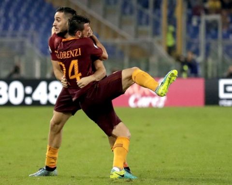 Roma¢s Kostas Manolas, left, celebrates with teammate Alessandro Florenzi after scoring, during a Serie A soccer match between Roma and Inter Milan, at Rome's Olympic Stadium, Sunday, Oct. 2, 2016. (AP Photo/Andrew Medichini)