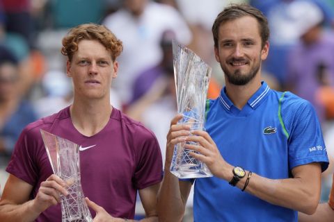 Daniil Medvedev, of Russia, right, and Jannik Sinner, of Italy, pose with their trophies after Medvedev beat Sinner, 7-5, 6-3, during the men's singles finals of the Miami Open tennis tournament, Sunday, April 2, 2023, in Miami Gardens, Fla. (AP Photo/Wilfredo Lee)