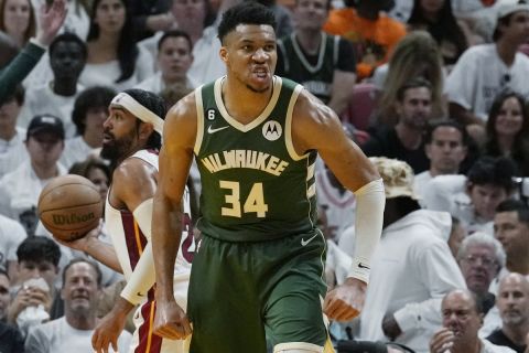 Milwaukee Bucks forward Giannis Antetokounmpo (34) gestures after dunking the ball during the second half of Game 4 in a first-round NBA basketball playoff series against the Miami Heat, Monday, April 24, 2023, in Miami. (AP Photo/Marta Lavandier)
