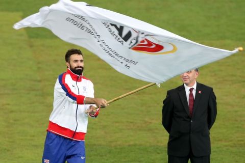 BEIJING, CHINA - AUGUST 30:  Martyn Rooney Captain of Great Britain waves the IAAF flag during the closing ceremony during day nine of the 15th IAAF World Athletics Championships Beijing 2015 at Beijing National Stadium on August 30, 2015 in Beijing, China.  (Photo by Lintao Zhang/Getty Images for IAAF)