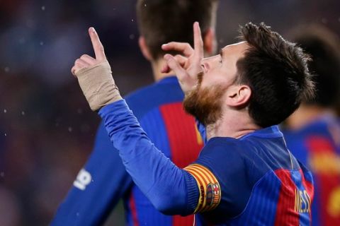 FC Barcelona's Lionel Messi celebrates after scoring during the Spanish La Liga soccer match between FC Barcelona and Real Sociedad at the Camp Nou stadium in Barcelona, Spain, Saturday, April 15, 2017. (AP Photo/Manu Fernandez)