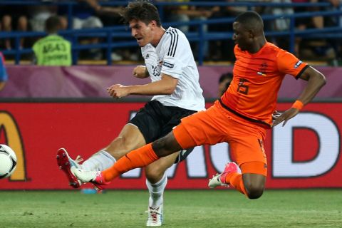 KHARKOV, UKRAINE - JUNE 13:  Mario Gomez of Germany scores their second goal during the UEFA EURO 2012 group B match between Netherlands and Germany at Metalist Stadium on June 13, 2012 in Kharkov, Ukraine.  (Photo by Julian Finney/Getty Images)
