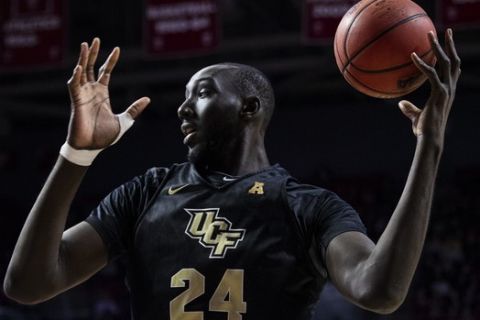Central Florida's Tacko Fall pulls down the rebound during the second half of an NCAA college basketball game against Temple, Saturday, March 9, 2019, in Philadelphia. Temple won 67-62. (AP Photo/Chris Szagola)