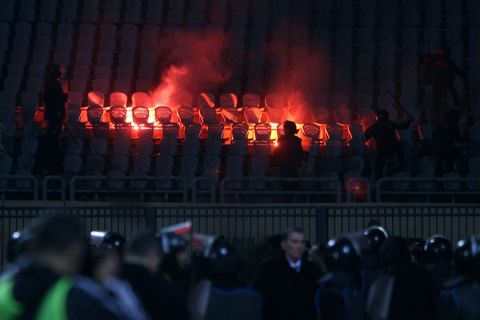 Riot police fill the stadium during clashes that erupted after a football match between Egypt's Al-Ahly and Al-Masry teams in Cairo on February 1, 2012. At least 40 people were killed and hundreds injured according to medical sources. AFP PHOTO/STR  (Photo credit should read -/AFP/Getty Images)