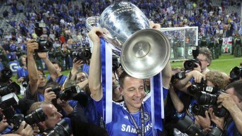 Chelsea's John Terry holds the trophy at the end of the Champions League final soccer match between Bayern Munich and Chelsea in Munich, Germany Saturday May 19, 2012. Chelsea's Didier Drogba scored the decisive penalty in the shootout as Chelsea beat Bayern Munich to win the Champions League final after a dramatic 1-1 draw on Saturday. (AP Photo/Matt Dunham)