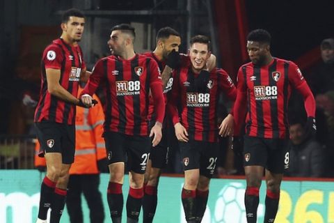 Bournemouth's Harry Wilson, second right, celebrates scoring his side's first goal of the game against Brighton and Hove Albion during their English Premier League soccer match at the Vitality Stadium in Bournemouth, England, Tuesday Jan. 21, 2020. (Mark Kerton/PA via AP)