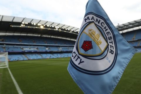 The club logo decorates a corner flag before the English Premier League soccer match between Manchester City and Newcastle United at the Etihad Stadium in Manchester, England, Saturday, Sept. 1, 2018. (AP Photo/Jon Super)