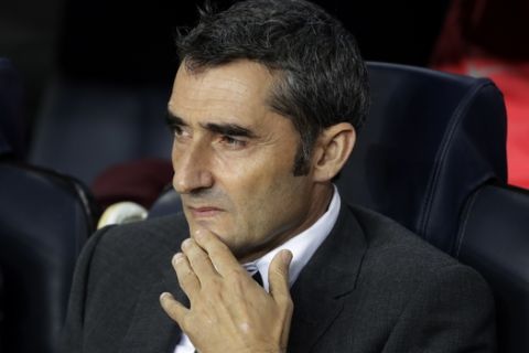 Barcelona coach Ernesto Valverde sits in the bench prior to the Champions League, Group B soccer match between Barcelona and Inter Milan, at the Nou Camp in Barcelona, Spain, Wednesday, Oct. 24, 2018. (AP Photo/Emilio Morenatti)