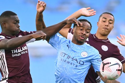 Leicester's Nampalys Mendy, left vies for the ball with Manchester City's Raheem Sterling, center and Leicester's Youri Tielemans during the English Premier League soccer match between Manchester City and Leicester City at the Etihad stadium in Manchester, England, Sunday, Sept. 27, 2020. (Laurence Griffiths/Pool via AP)