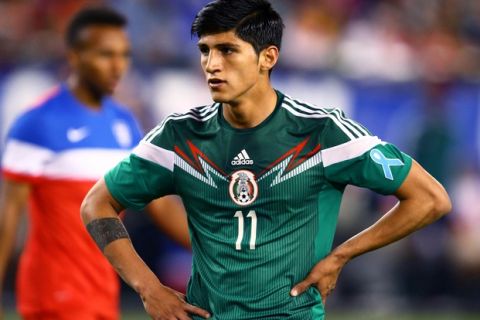 Apr 2, 2014; Glendale, AZ, USA; Mexico forward Alan Pulido (11) against USA during a friendly match at University of Phoenix Stadium. The game ended in a 2-2 tie. Mandatory Credit: Mark J. Rebilas-USA TODAY Sports
