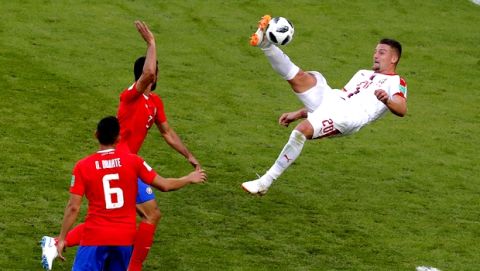 Serbia's Sergej Milinkovic-Savic, right, kicks the ball as Costa Rica's Giancarlo Gonzalez tries to stop him during the group E match between Costa Rica and Serbia at the 2018 soccer World Cup in the Samara Arena in Samara, Russia, Sunday, June 17, 2018. (AP Photo/Vadim Ghirda)
