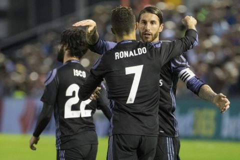 Real Madrid's Cristiano Ronaldo is congratulated by Sergio Ramos, right, after scoring the second goal during a Spanish La Liga soccer match between Celta and Real Madrid at the Balaidos stadium in Vigo, northern Spain, Wednesday, May 17, 2017. (AP Photo/Lalo R. Villar)