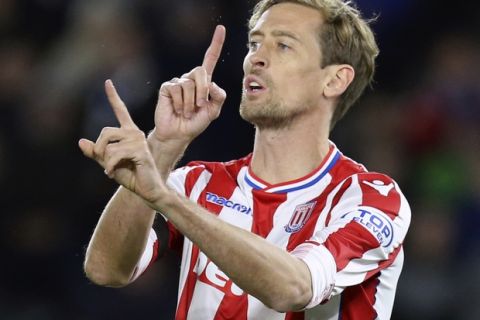 Stoke City's Peter Crouch comes on for his 143rd substitute appearance, a new English Premier League record, during the game against Brighton & Hove Albion during their English Premier League soccer match at the AMEX Stadium in Brighton, England, Monday Nov. 20, 2017. (Gareth Fuller/PA via AP)