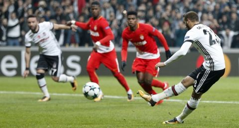 Besiktas' Cenk Tosun, right, scores his side's opening goal from penalty during the Champions League group G soccer match between Besiktas and Monaco at the Besiktas Park stadium in Istanbul, Wednesday, Nov. 1, 2017. (AP Photo/Lefteris Pitarakis)