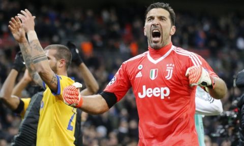 Juventus goalkeeper Gianluigi Buffon celebrates at the end of a the Champions League, round of 16, second-leg soccer match between Juventus and Tottenham Hotspur, at the Wembley Stadium in London, Wednesday, March 7, 2018. Juventus won 2-1. (AP Photo/Frank Augstein)