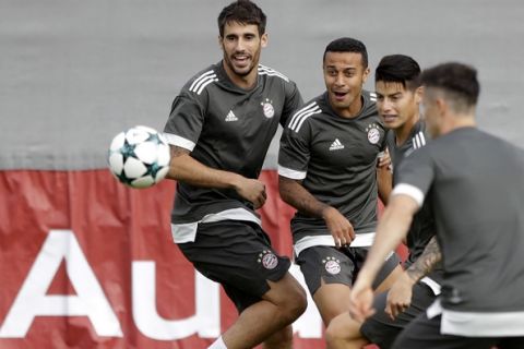 From left, Bayern's Javi Martinez, Thiago, James Rodriguez and Robert Lewandowski attend a training session in Munich, Germany, Monday, Sept. 11, 2017. Munich will face RSC Anderlecht on Tuesday for a Champions League group B first leg soccer match. (AP Photo/Matthias Schrader)