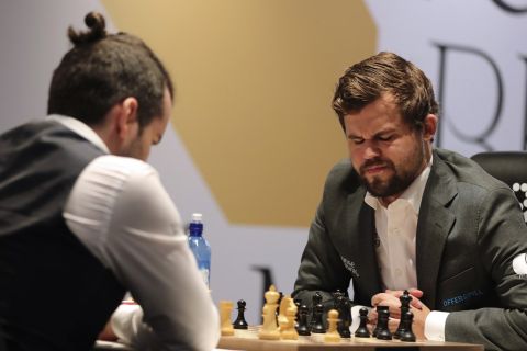 Norway's World Chess Champion Magnus Carlsen, reacts in game five against Ian Nepomniachtchi of Russia, during the FIDE World Championship at the Dubai Expo, in Dubai, United Arab Emirates, Wednesday, Dec. 1, 2021. (AP Photo/Kamran Jebreili)