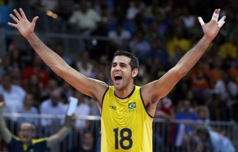 Brazil's Dante Amaral celebrates during a men's semifinal volleyball match against Italy at the 2012 Summer Olympics, Friday, Aug. 10, 2012, in London. (AP Photo/Jeff Roberson)