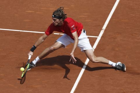 Stefanos Tsitsipas of Greece returns the ball in his semifinal match against Spain's Pablo Carreno Busta during the Barcelona Open Tennis Tournament in Barcelona, Spain, Saturday, April 28, 2018. (AP Photo/Manu Fernandez)