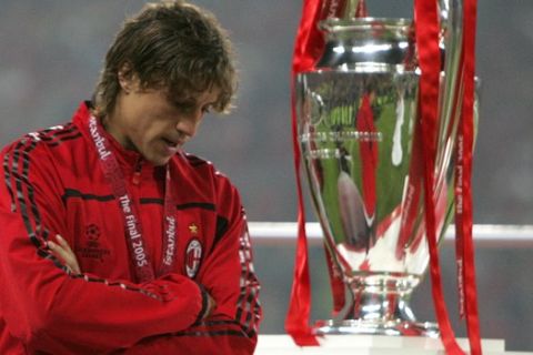 A dejected Hernan Crespo of AC Milan stands near the trophy after the UEFA Champions League Final between AC Milan and Liverpool at the Ataturk Olympic Stadium in Turkey, Istanbul Wednesday May 25, 2005. Liverpool won 3-2 on penalties after the match finished 3-3 after extra time.  (AP Photo/Luca Bruno)