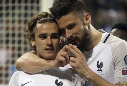 France's Antoine Griezmann, left, and France's Olivier Giroud celebrate a goal during their World Cup 2018 Group A qualifying soccer match against Luxembourg at the Josy Barthel stadium in Luxembourg on Saturday, March 25, 2017. (AP Photo/Olivier Matthys)