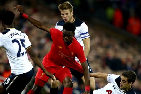 Liverpool's Oviemuno Ejaria, centre, is surrounded by Tottenham Hotspur's Joshua Onomah, Eric Dier and Harry Winks, left - right, during the English League Cup soccer match between Liverpool and Tottenham Hotspur at Anfield in Liverpool,  England, Tuesday, Oct. 25, 2016.(AP Photo/Dave Thompson)