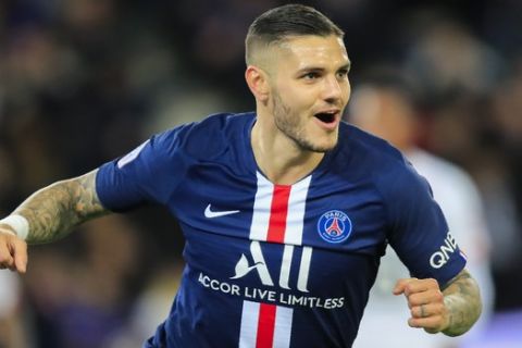 PSG's Mauro Icardi celebrates after scoring the opening goal during French League One soccer match between Paris Saint-Germain and Lille at the Parc des Princes stadium in Paris, Friday, Nov. 22, 2019. (AP Photo/Michel Euler)
