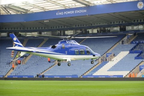 An helicopter arrives at King Power stadium to pick up Leicester City Chairman Vichai Srivaddhanaprabha after the English Premier League soccer match between Leicester City and Southampton at the King Power Stadium in Leicester, England, Sunday, April 3, 2016. (AP Photo/Rui Vieira)