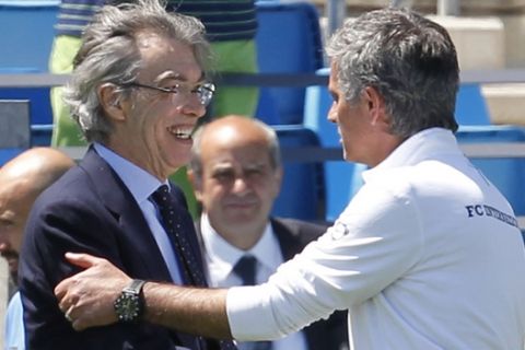 Inter Milan coach Jose Mourinho, right greet Inter Milan President Massimo Moratti during a training session at the Valdebebas training ground in Madrid, Friday, May 21, 2010. Inter Milan will face Bayern in the Champions League final soccer match at the Bernabeu on Saturday May 22.(AP Photo/Antonio Calanni)