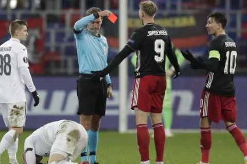Feyenoord's Nicolai Jorgensen is shown a red card by referee Kristo Tohver during the Europa League Group K soccer match between CSKA Moscow and Feyenoord at CSKA Arena in Moscow, Russia, Thursday, Nov. 26, 2020. (AP Photo/Pavel Golovkin, Pool)