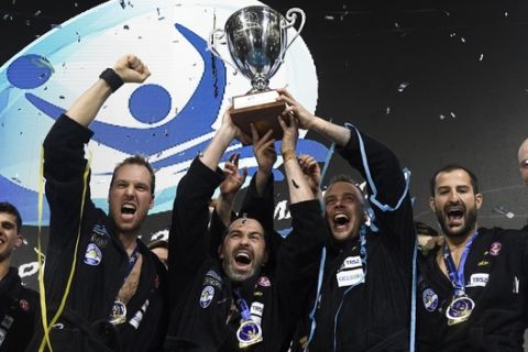 Players of Szolnoki VSK of Hungary celebrate with the trophy after they defeated Jug Dubrovnik of Croatia by 10-5 in the men's water polo Champions' League Final Six final match in Duna Arena in Budapest, Hungary, Saturday, May 27, 2017. (Tamas Kovacs/MTI via AP)