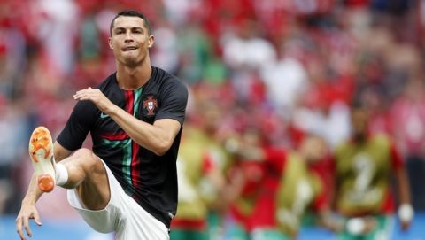 Portugal's Cristiano Ronaldo warms up prior the group B match between Portugal and Morocco at the 2018 soccer World Cup in the Luzhniki Stadium in Moscow, Russia, Wednesday, June 20, 2018. (AP Photo/Francisco Seco)