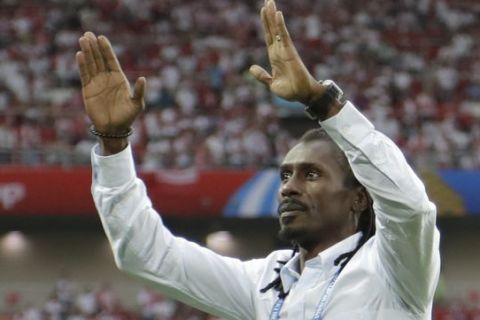 Senegal's head coach Aliou Cisse celebrates as his team won the group H match between Poland and Senegal at the 2018 soccer World Cup in the Spartak Stadium in Moscow, Russia, Tuesday, June 19, 2018. Senegal won 2-1. (AP Photo/Andrew Medichini)