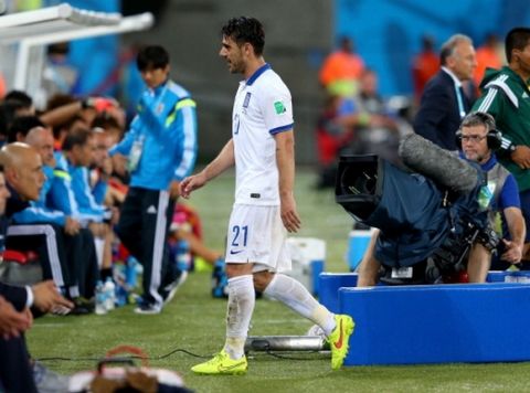 NATAL, BRAZIL - JUNE 19:  Konstantinos Katsouranis of Greece walks off the pitch after receiving a red card during the 2014 FIFA World Cup Brazil Group C match between Japan and Greece at Estadio das Dunas on June 19, 2014 in Natal, Brazil.  (Photo by Alex Livesey - FIFA/FIFA via Getty Images)