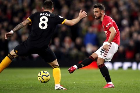 Manchester United's Bruno Fernandes, controls the ball, during the English Premier League soccer match between Manchester United and Wolverhampton Wanderers, at Old Trafford, in Manchester, England, Saturday, Feb. 1, 2020. (Martin Rickett/PA via AP)