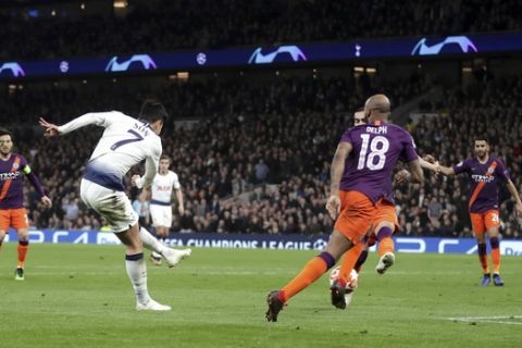 Tottenham Hotspur's Son Heung-min, left, scores his side's first goal of the game during the  Champions League quarter final, first leg match against Manchester City at Tottenham Hotspur Stadium, London, Tuesday April 9, 2019. (Adam Davy/PA via AP)