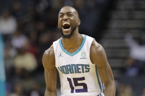 Charlotte Hornets' Kemba Walker (15) reacts to his basket against the Miami Heat in the second half of an NBA basketball game in Charlotte, N.C., Tuesday, Oct. 30, 2018. (AP Photo/Chuck Burton)