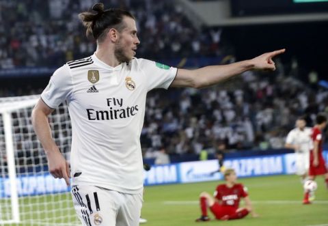 Real Madrid's midfielder Gareth Bale celebrates after scoring his side's opening goal during the Club World Cup semifinal soccer match between Real Madrid and Kashima Antlers at Zayed Sports City stadium in Abu Dhabi, United Arab Emirates, Wednesday, Dec. 19, 2018. (AP Photo/Hassan Ammar)