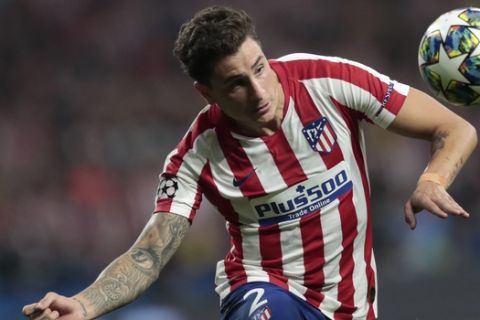 Atletico Madrid's Jose Gimenez heads the ball during the Champions League Group D soccer match between Atletico Madrid and Juventus at the Wanda Metropolitano stadium in Madrid, Spain, Wednesday, Sept. 18, 2019. (AP Photo/Bernat Armangue)