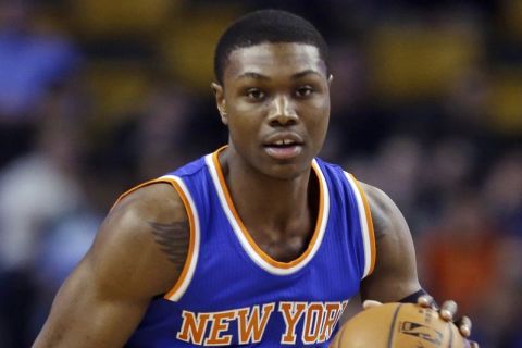 New York Knicks forward Cleanthony Early (17) dribbles up court during the first half of an NBA basketball game against the Boston Celtics in Boston, Wednesday, Feb. 25, 2015. (AP Photo/Elise Amendola)