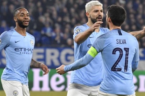 Manchester City forward Sergio Aguero, center, celebrates with his teammates after scoring his side's opening goal during the first leg, round of sixteen, Champions League soccer match between Schalke 04 and Manchester City at Veltins Arena in Gelsenkirchen, Germany, Wednesday Feb. 20, 2019. (AP Photo/Martin Meissner)