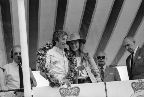 Jochen Rindt, of Austria with his wife Nina beside him, wears the victors laurels after wining the British Grand Prix at Brands Hatch, Kent, England on July 18, 1970. Rindt was later disqualified because of a technical dispute over the airfoils on his Lotus-Ford car but was reinstated as the winner later. Others unidentified. (AP Photo)