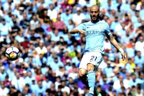 Manchester City's David Silva passes the ball during the English Premier League soccer match between Manchester City and Huddersfield Town at Etihad stadium in Manchester, England, Sunday, May 6, 2018. (AP Photo/Rui Vieira)