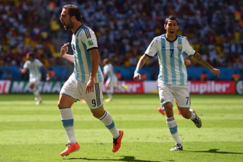 BRASILIA, BRAZIL - JULY 05: Gonzalo Higuain of Argentina (L) celebrates scoring his team's first goal with Angel di Maria during the 2014 FIFA World Cup Brazil Quarter Final match between Argentina and Belgium at Estadio Nacional on July 5, 2014 in Brasilia, Brazil.  (Photo by Matthias Hangst/Getty Images)