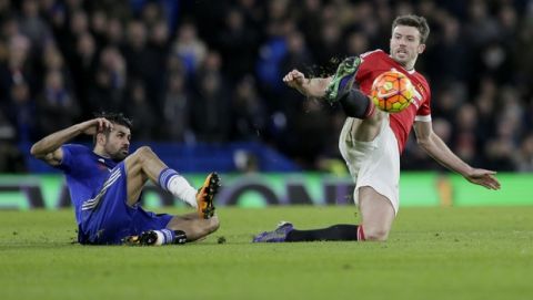 Chelsea's Diego Costa, left, competes for the ball with Manchester United's Michael Carrick during the English Premier League soccer match between Chelsea and Manchester United at Stamford Bridge stadium in London, Sunday, Feb. 7, 2016.  (AP Photo/Tim Ireland)
