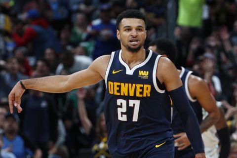 Denver Nuggets guard Jamal Murray reacts after hitting a 3-point basket against the Boston Celtics in the second half of an NBA basketball game, Monday, Nov. 5, 2018, in Denver. The Nuggets won 115-107. (AP Photo/David Zalubowski)