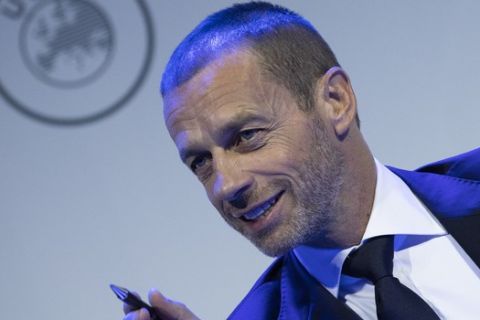 UEFA President Aleksander Ceferin looks up during a meeting of European soccer leaders at the congress of the UEFA governing body in Amsterdam's Beurs van Berlage, Netherlands, Tuesday, March 3, 2020. (AP Photo/Peter Dejong)