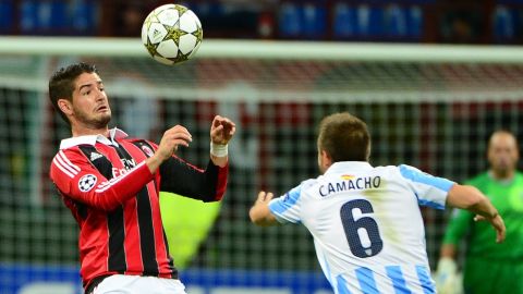 AC Milan's Brazilian forward Pato (L) fights for the ball with Malaga's defender Ignacio Camacho during the Champions league football match AC Milan vs Malaga on November 6, 2012 at San Siro Stadium in Milan. AFP PHOTO / OLIVIER MORIN        (Photo credit should read OLIVIER MORIN/AFP/Getty Images)